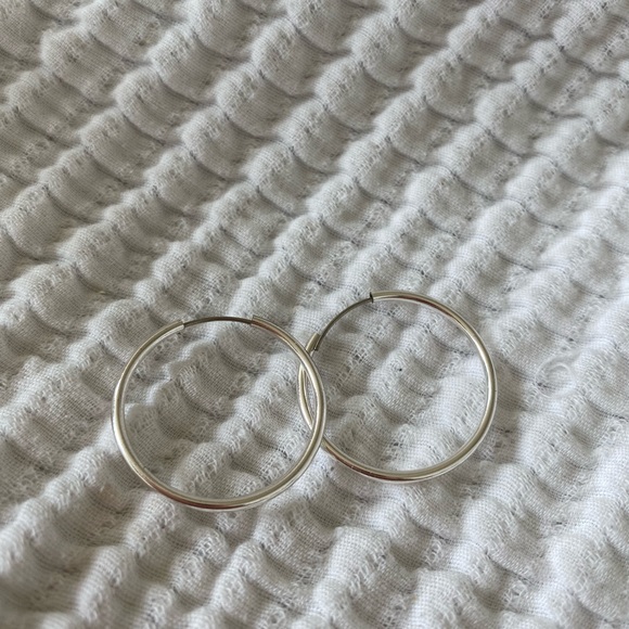 Brand new medium size silver hoop earrings. No flaws - Picture 2 of 2